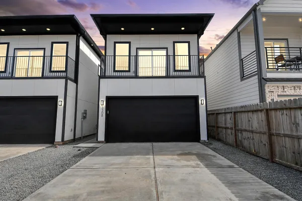 a front view of a house with a entrance gate