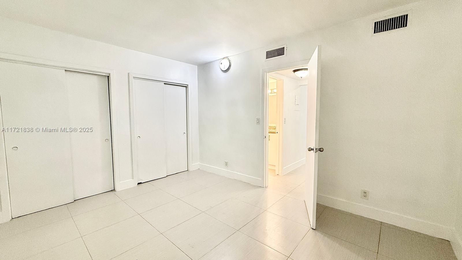 42 Southwest 14th Street, Unit 103 Dania Beach, FL 33004 - Photo 15 of 18 a view of an empty room