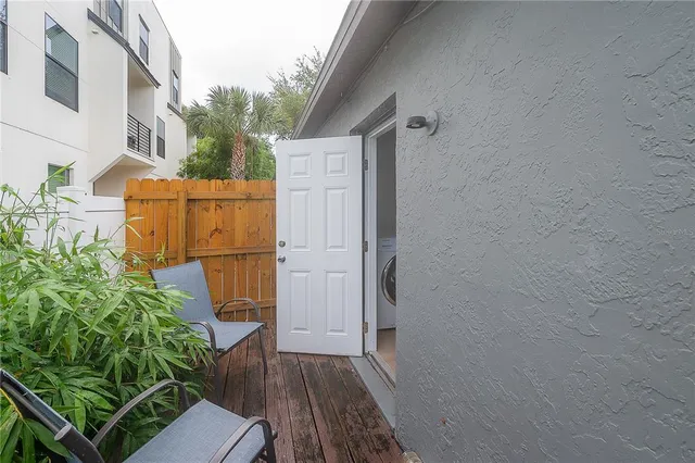 a backyard of a house with wooden floor