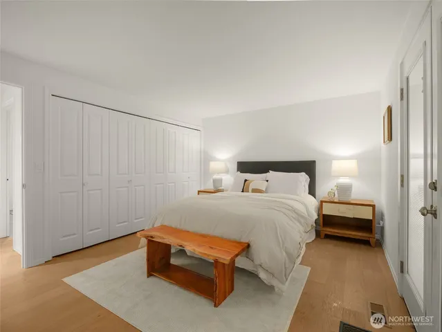 a bed room with a bed and a lamp