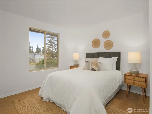 a bedroom with a bed and window