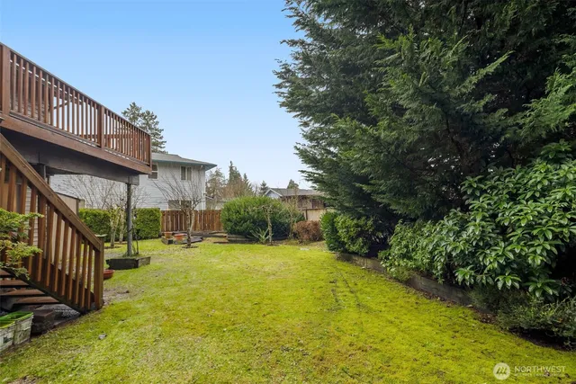 a view of a house with pool and garden