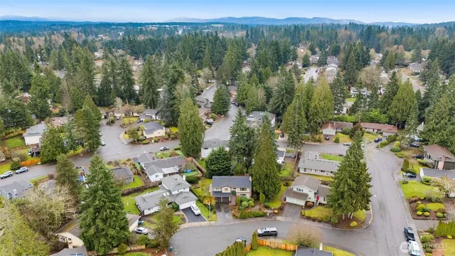 an aerial view of a house with a swimming pool yard and outdoor seating