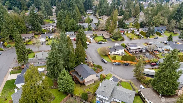 an aerial view of residential house with outdoor space and swimming pool