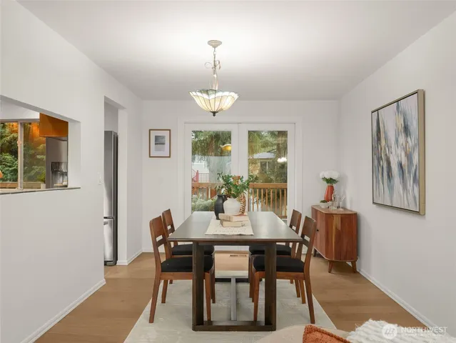 a view of a dining room with furniture window and outside view