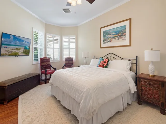 a bathroom with a granite countertop sink vanity mirror and shower