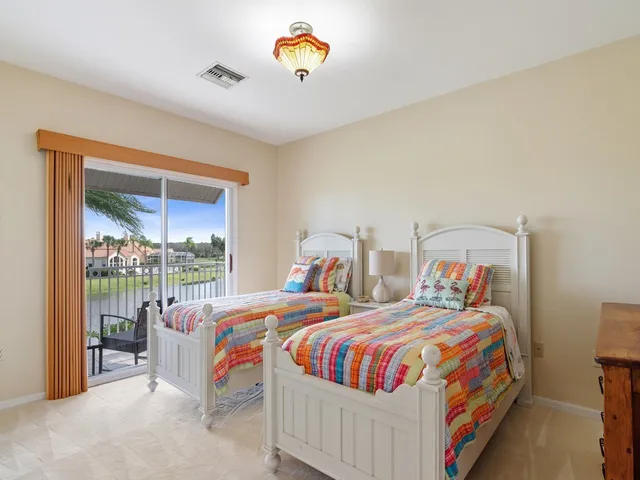 a bathroom with double vanity sinks and a mirror