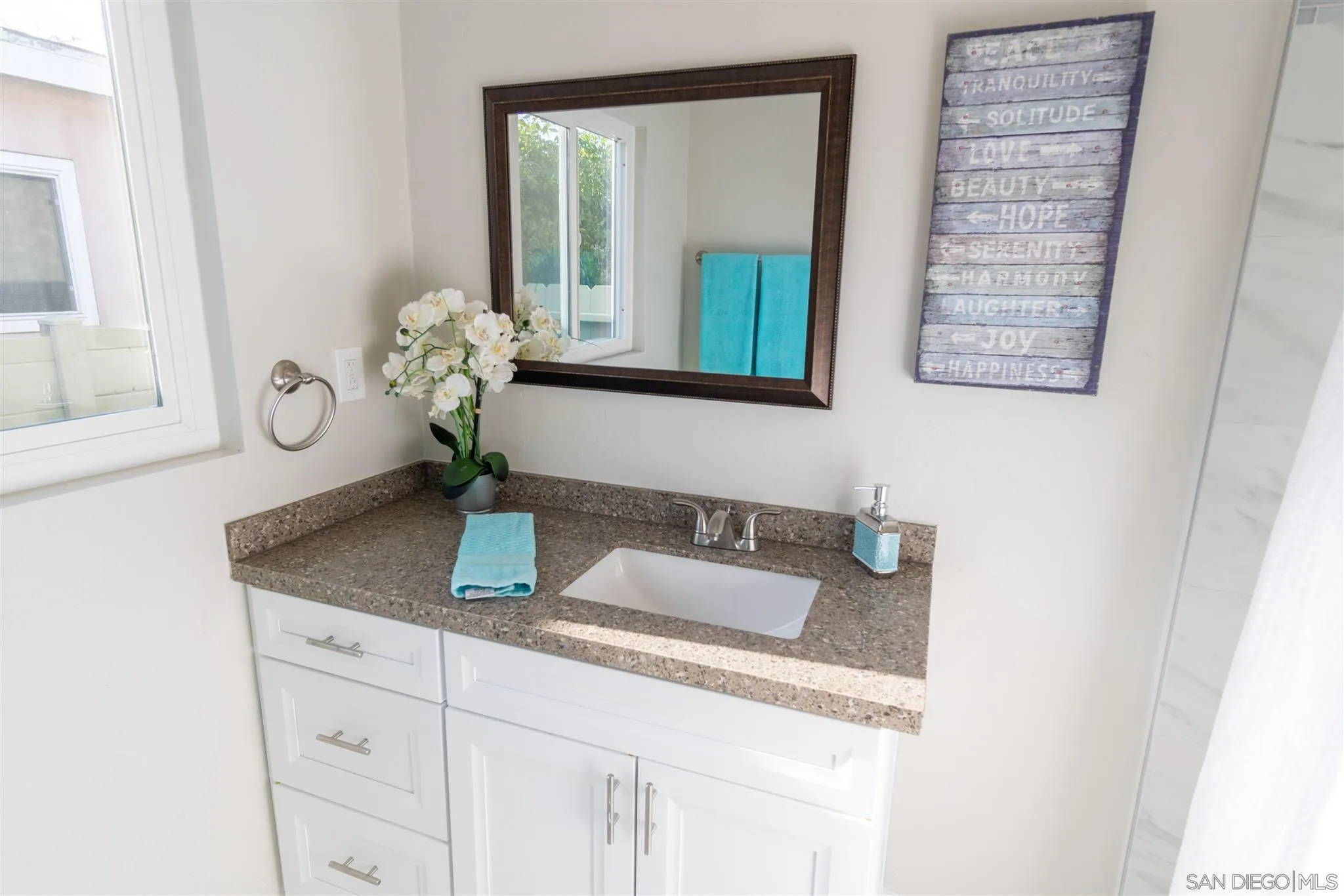 466 Cedar Street El Cajon, CA 92021 - Photo 18 of 26 a bathroom with a granite countertop sink and a mirror
