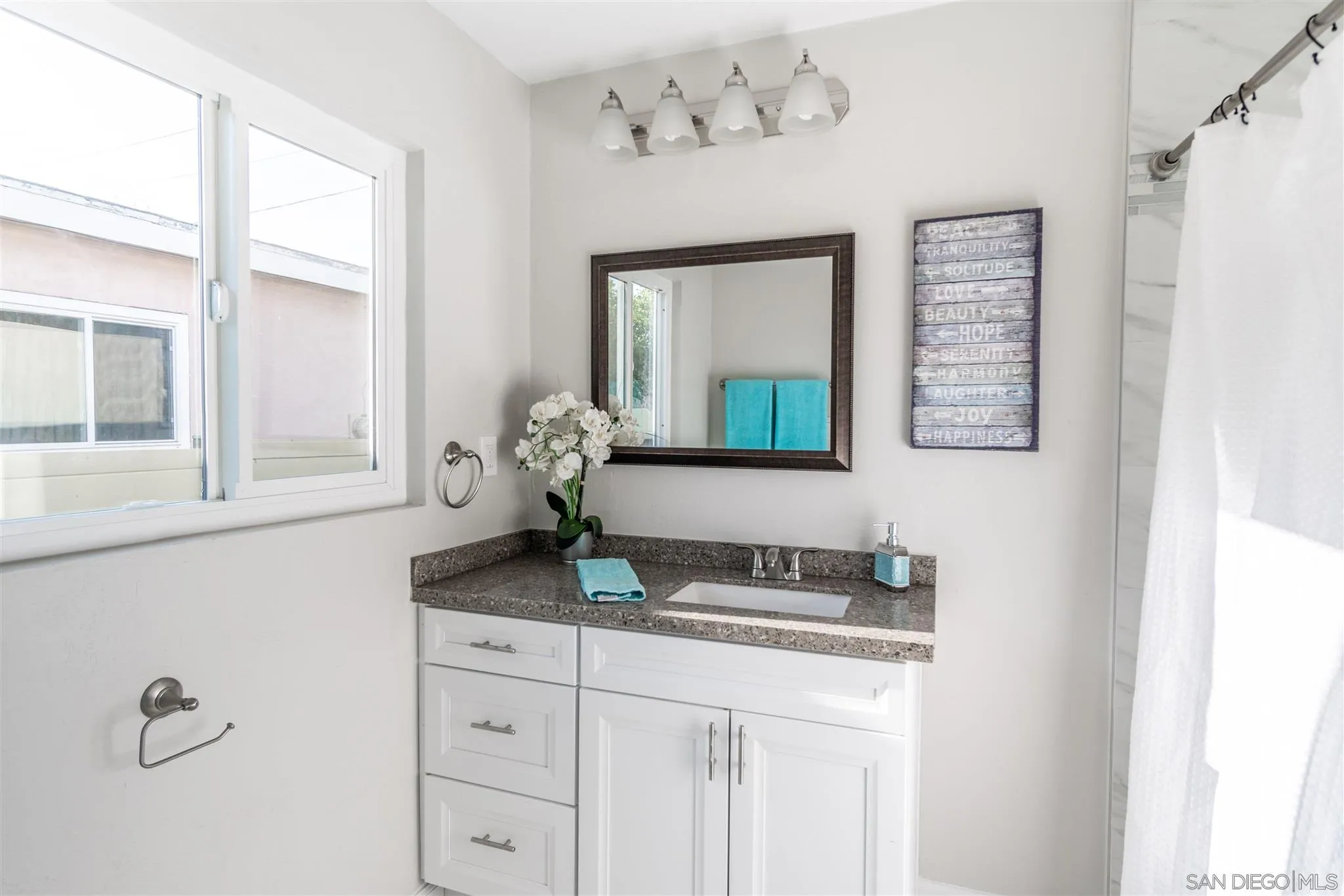 466 Cedar Street El Cajon, CA 92021 - Photo 19 of 26 a bathroom with a granite countertop sink and a mirror