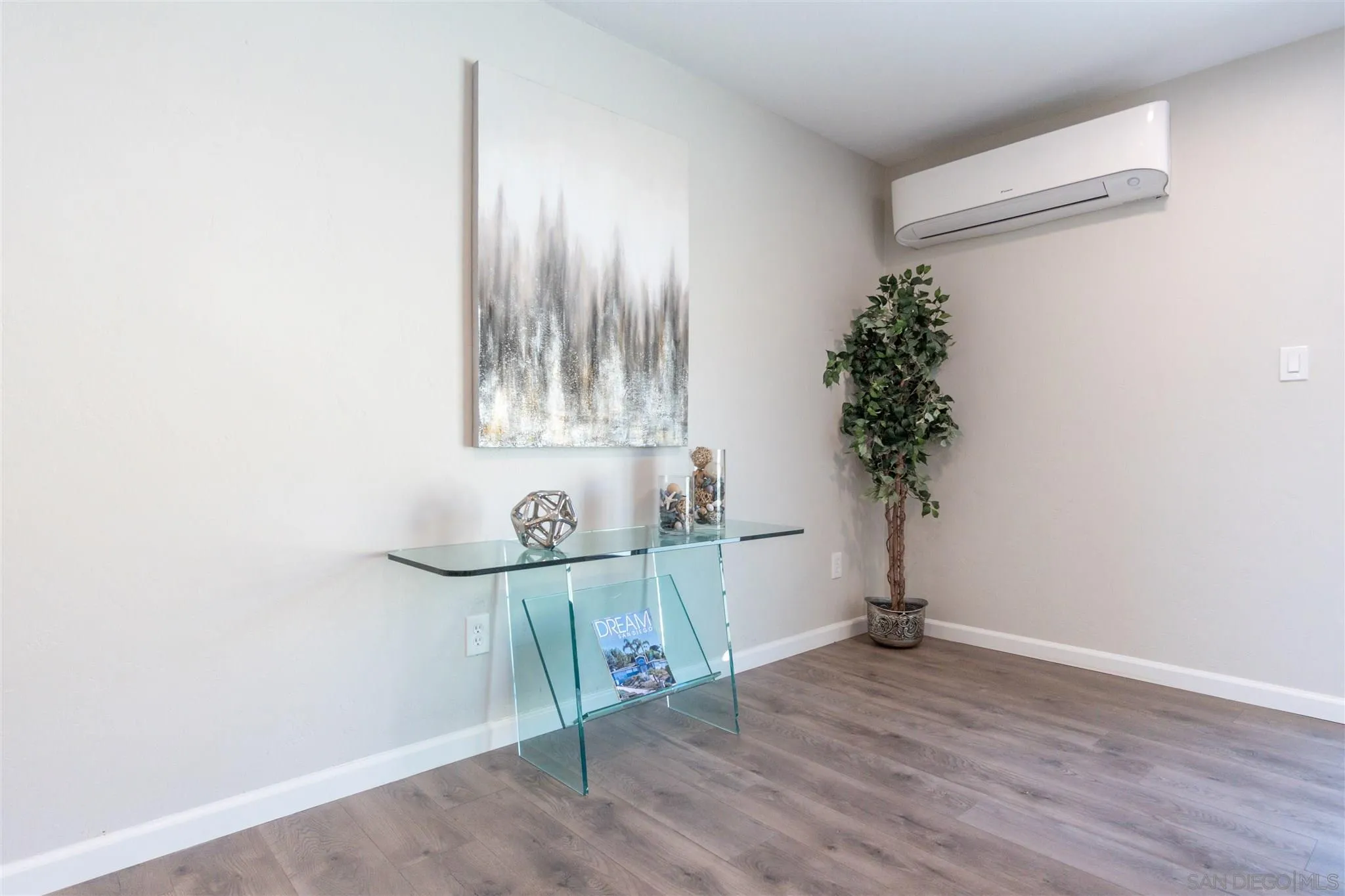 466 Cedar Street El Cajon, CA 92021 - Photo 8 of 26 a view of a room with wooden floor and potted plant