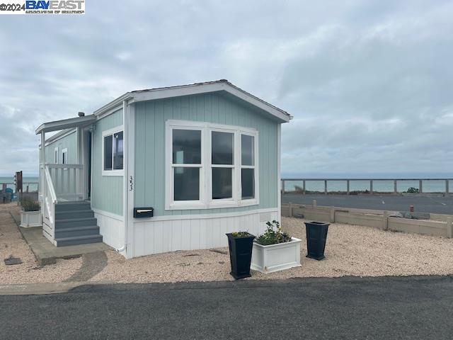 a view of a house with wooden fence