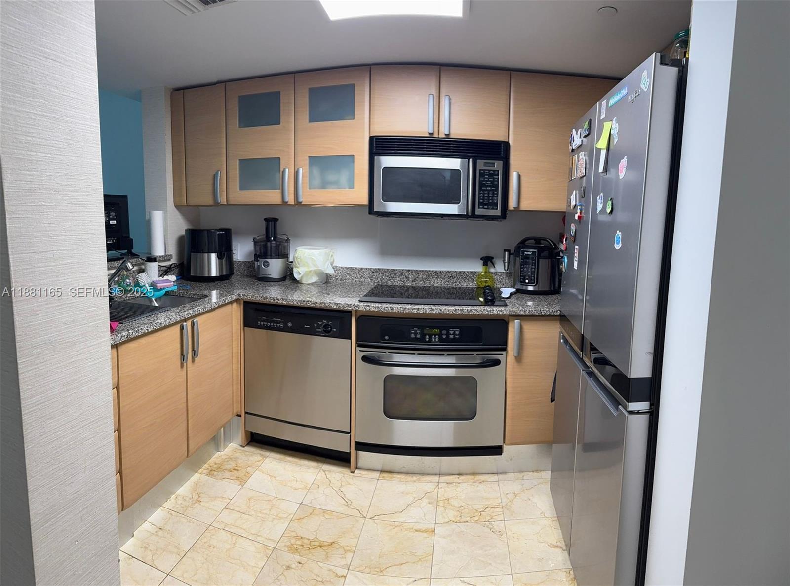 2101 Brickell Avenue, Unit 308 Miami, FL 33129 - Photo 11 of 19 a kitchen with a sink stove and microwave
