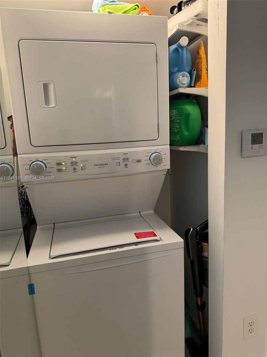 2101 Brickell Avenue, Unit 308 Miami, FL 33129 - Photo 13 of 19 a utility room with dryer and washer