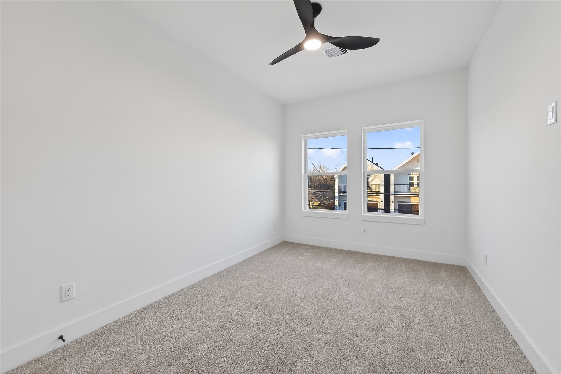 3514 Good Hope Street, Unit B Houston, TX 77021 - Photo 17 of 26 This bright bedroom features two large windows for natural light, and a modern ceiling fan, creating a cozy and inviting space.