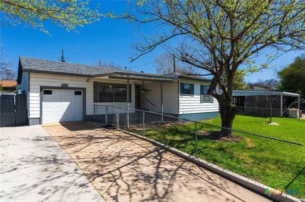 a house view with a backyard space
