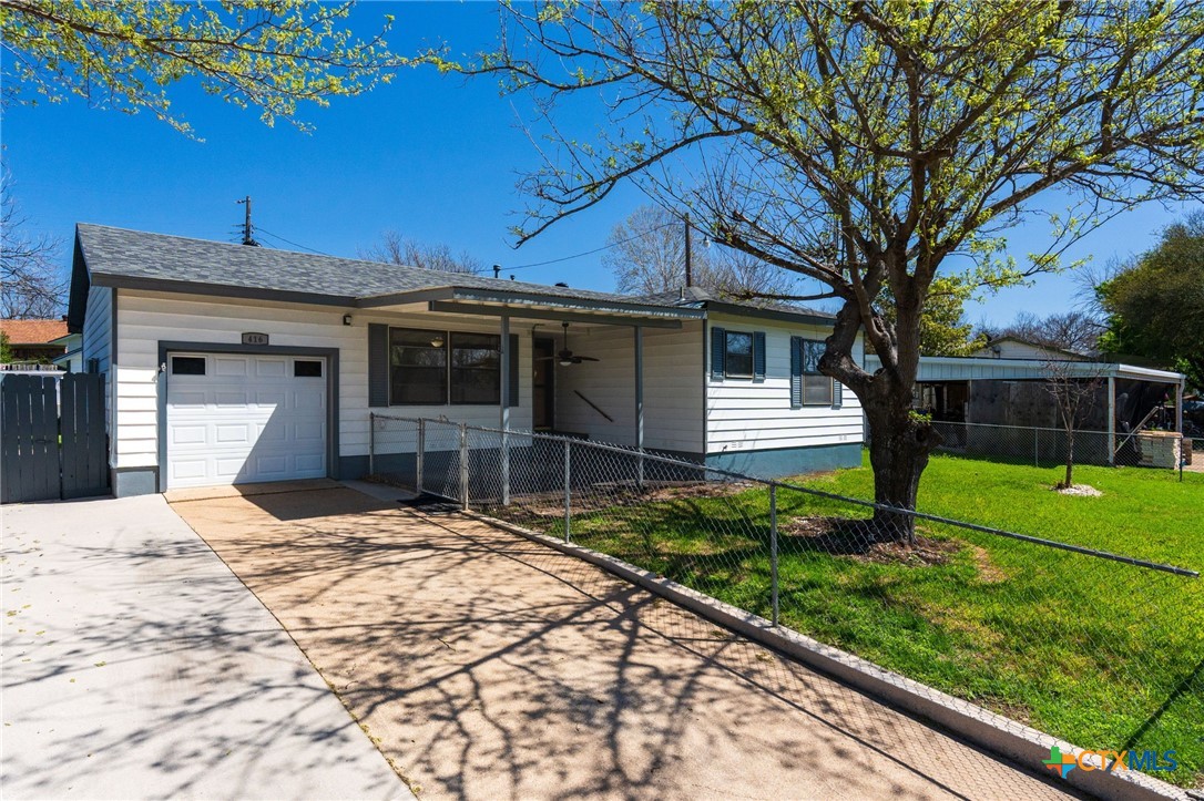a house view with a backyard space