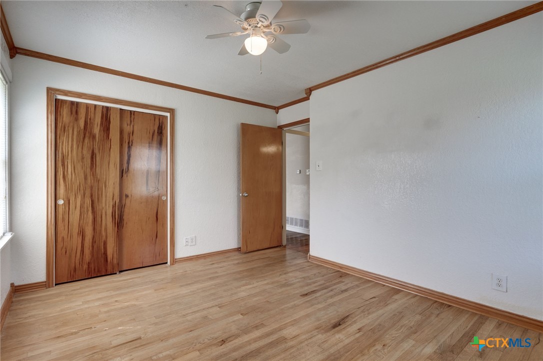 416 Cardinal Avenue Killeen, TX 76541 - Photo 4 of 18 a view of an empty room with wooden floor