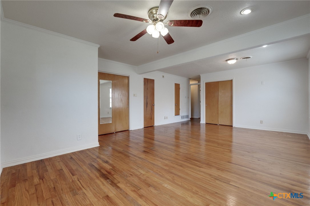 416 Cardinal Avenue Killeen, TX 76541 - Photo 6 of 18 a view of an empty room with wooden floor