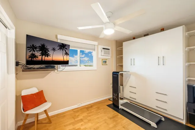 a room with furniture and a flat screen tv