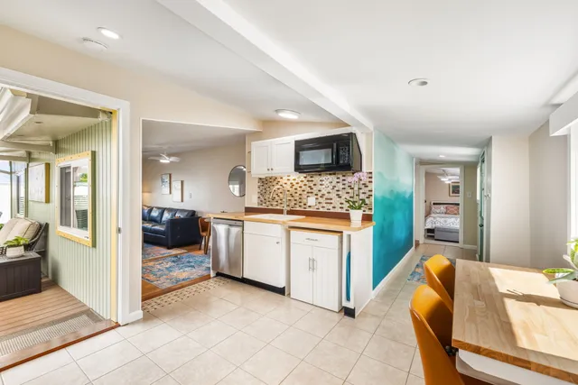 a spacious bedroom with a bed and furniture