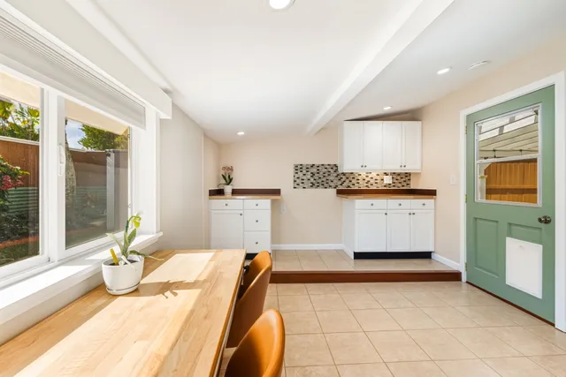 a bedroom with furniture and window