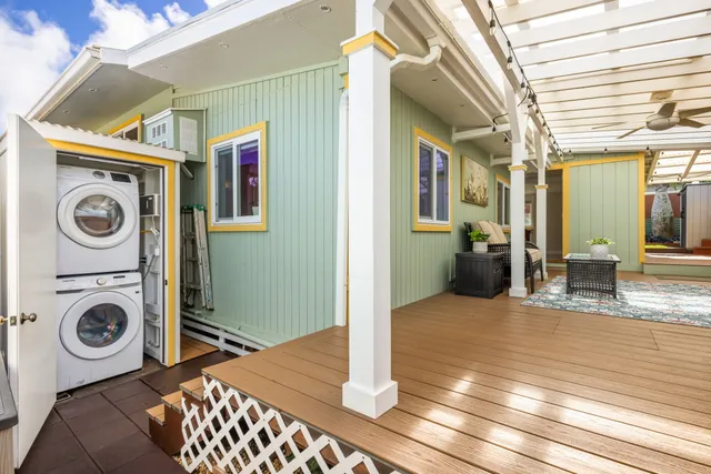 a view of a hallway with washer and dryer