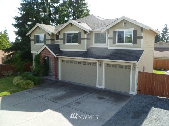 432 199th Place Southeast Bothell, WA 98012 - Photo 1 of 1 a front view of a house with a yard and garage