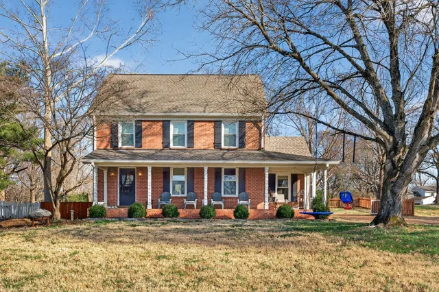 a front view of a brick building with many windows