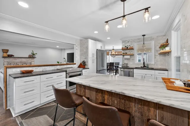 a dining room with furniture and window