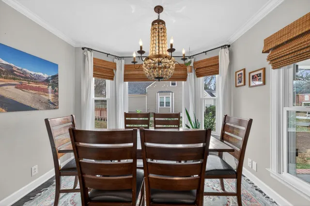 a living room with fireplace furniture and a flat screen tv