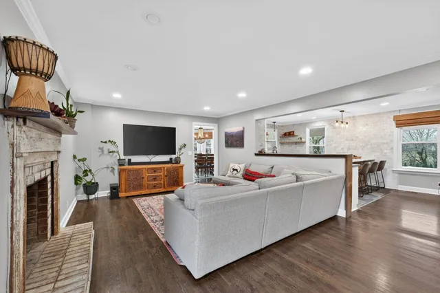 a bathroom with a granite countertop sink a toilet and a shower curtain