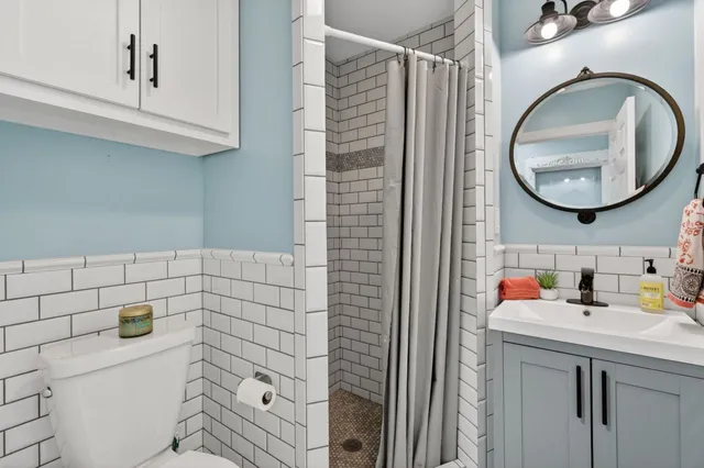 a bedroom with furniture and wooden floor