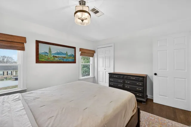 a front view of a building with a yard