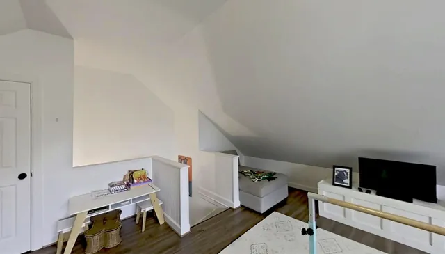 a view of a building with a large tree