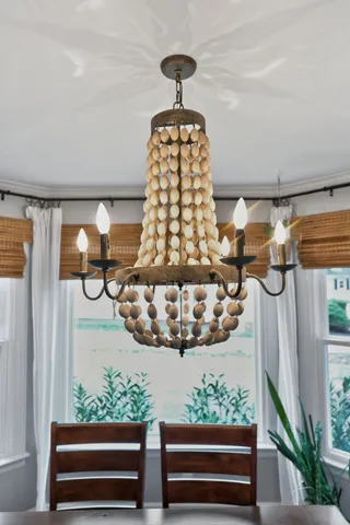 a view of a patio with couches and a dining table with garden view