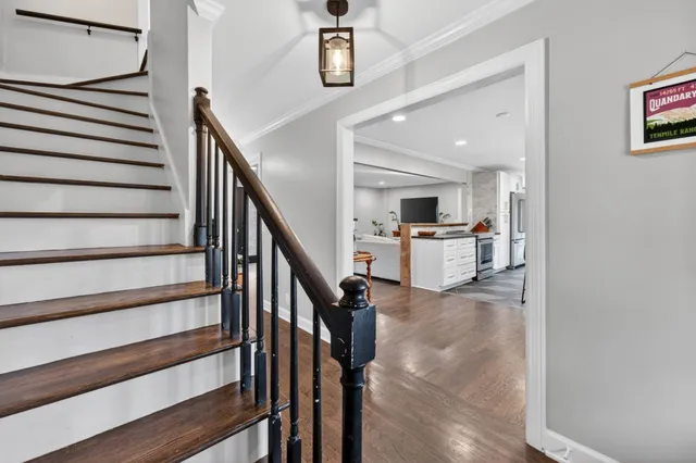 a view of kitchen with cabinets and wooden floor