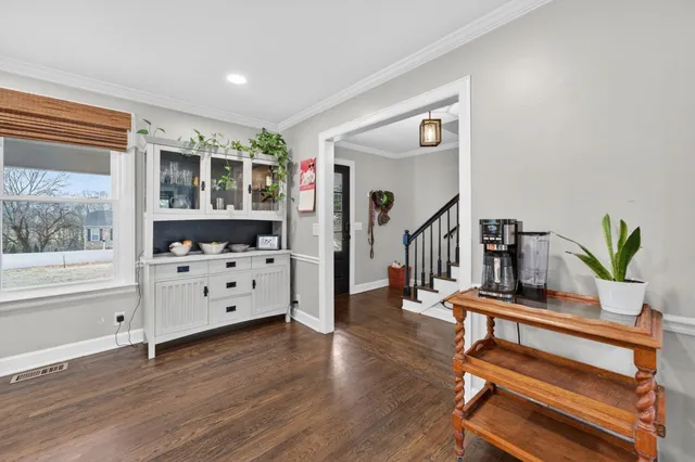 a kitchen with stainless steel appliances kitchen island granite countertop a sink and cabinets