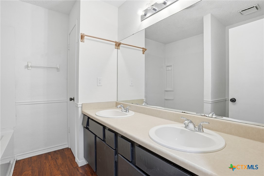 922 North 7th Street Copperas Cove, TX 76522 - Photo 19 of 26 a bathroom with a sink and a mirror