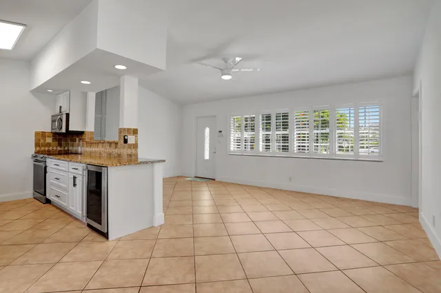 a kitchen with stainless steel appliances granite countertop a stove a sink and a granite counter tops