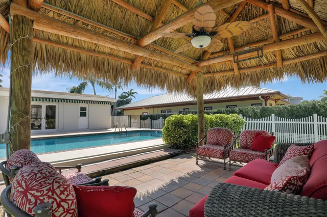 a view of two chairs in the patio