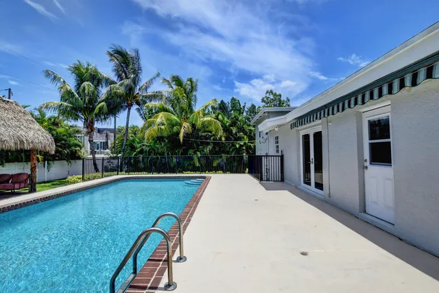 a view of a swimming pool and lounge chair