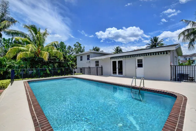 a view of yard from deck having patio