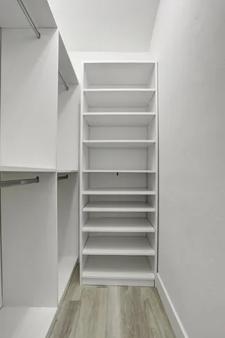 a bathroom with a sink toilet and window