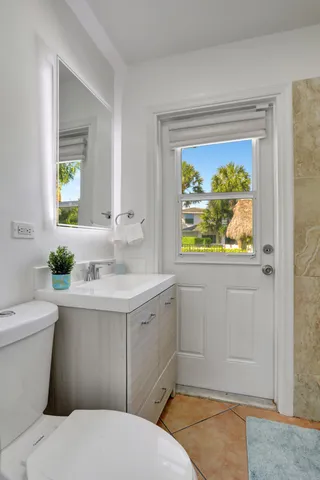 a bathroom with a shower and toilet