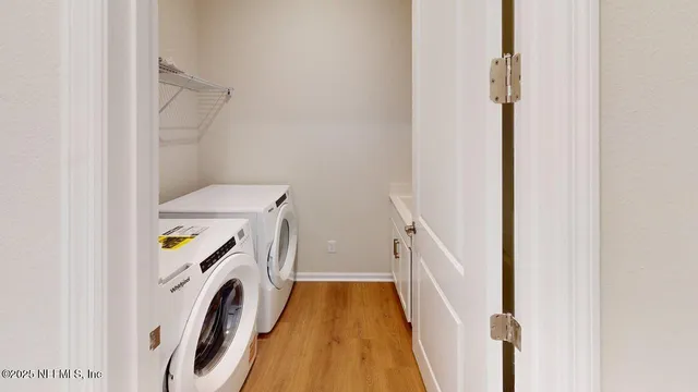 a utility room with dryer and washer