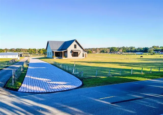 a view of a swimming pool with an ocean view