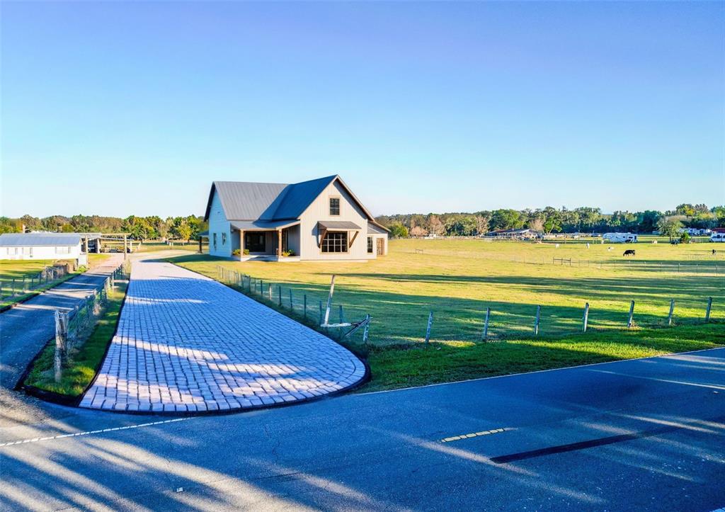 Powerline Road Dade City, FL 33523 - Photo 1 of 10 a view of a swimming pool with an ocean view