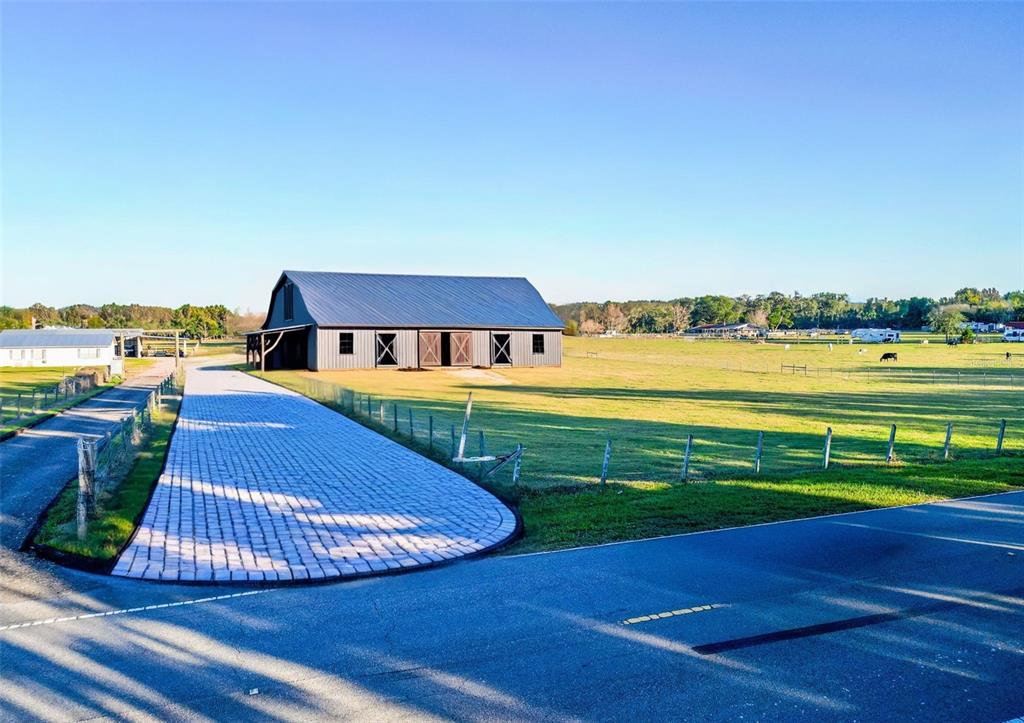 Powerline Road Dade City, FL 33523 - Photo 2 of 10 a view of a swimming pool with a lounge chairs