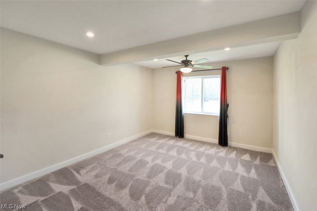 6334 Ryan Road Medina, OH 44256 - Photo 26 of 32 Carpeted spare room featuring ceiling fan