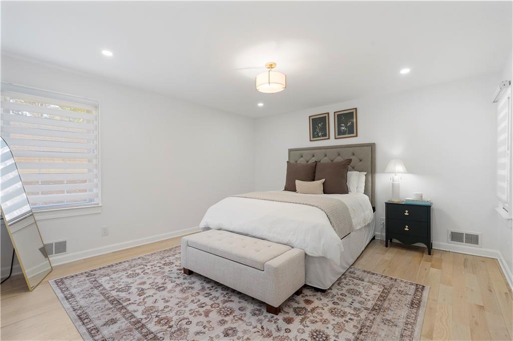 403 Rockbridge Road Southwest Lilburn, GA 30047 - Photo 26 of 77 a bedroom with a bed and a window